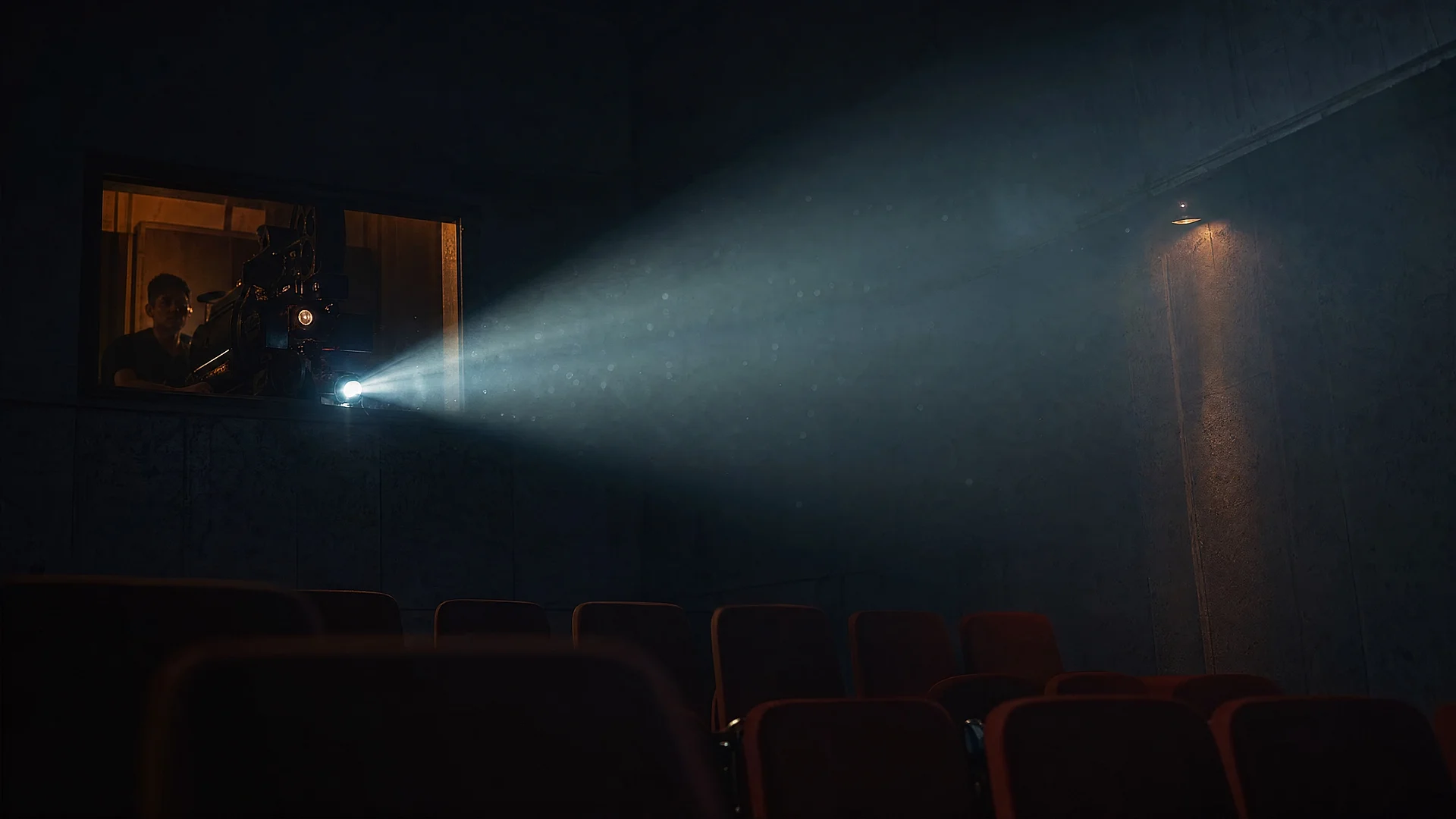 Projected reel running in a darkened screening room