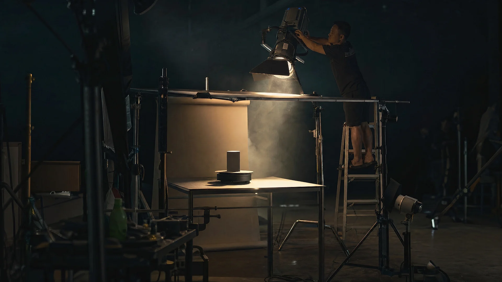 A tabletop commercial rig lit on a studio stage